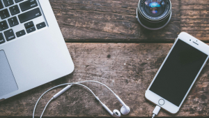 laptop and phone and ear buds