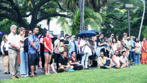 People standing respectfully