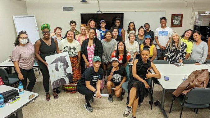 group shot with portrait of alice ball held up