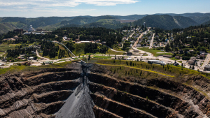 large hole in ground near a town