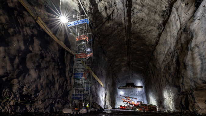 big cavern with workers and instruments