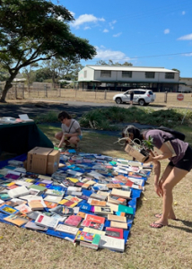 people sorting through books
