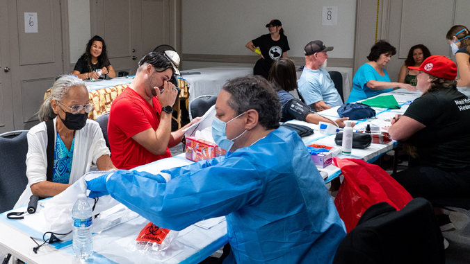 people conducting tests on patients