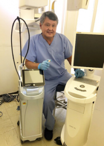 Fujimoto in scrubs with dental equipment