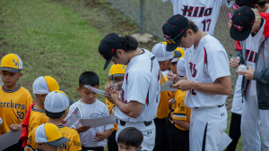 players in jerseys signing autographs