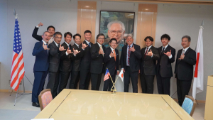 President Lassner shakas with Asahi University faculty