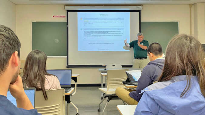 person speaking to a group of students