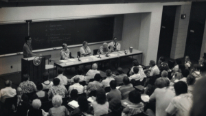 people sitting in a large classroom