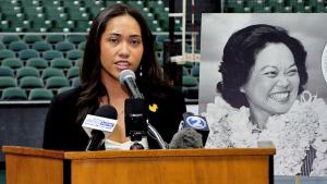 woman at speaker podium