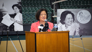 woman at speaker podium