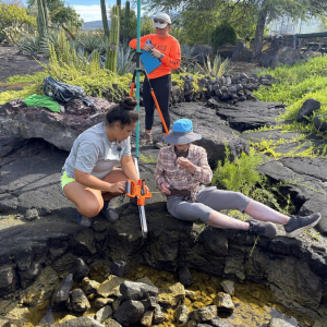 3 people measuring sea level heights