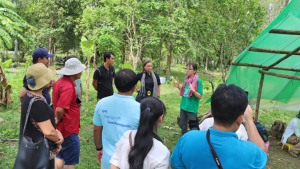 people gather around and listen to person speaking