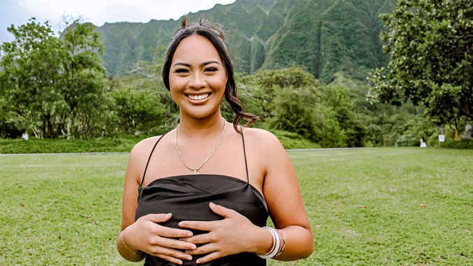 person headshot with mountains in the background