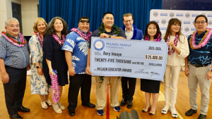people standing with a large check
