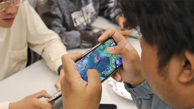 person playing video games on a phone