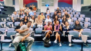 people sitting in a large room