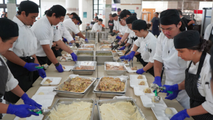 Two lines of people preparing lunches