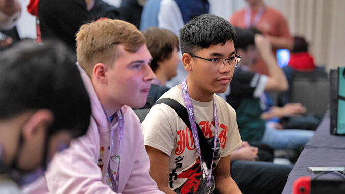 people playing games near a television