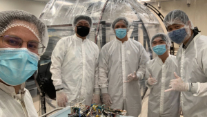 person in a lab with other people