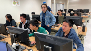 people looking at computer monitors