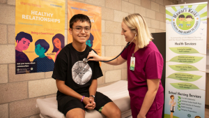 school nurse checks on student