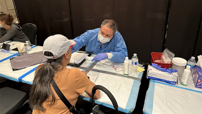 person medically testing a patient