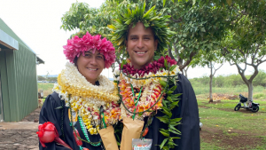 Two smiling grads