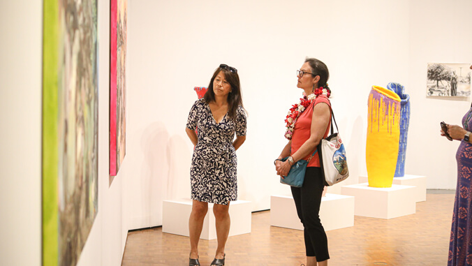two people in an art gallery