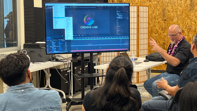 Class with looking at a monitor