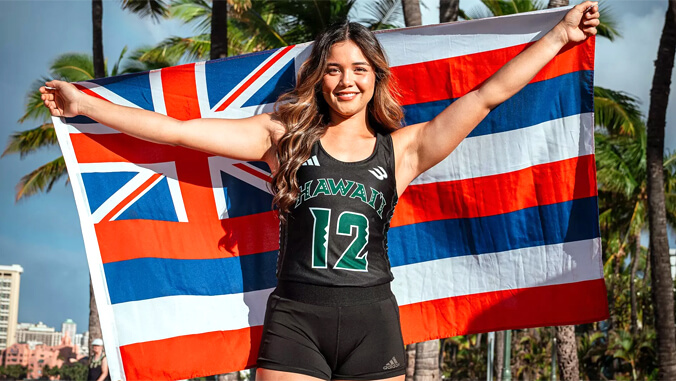 Sabrina Hardisty holding state flag behind her