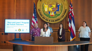 people speaking at a podium