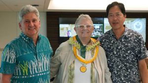 Three people smiling