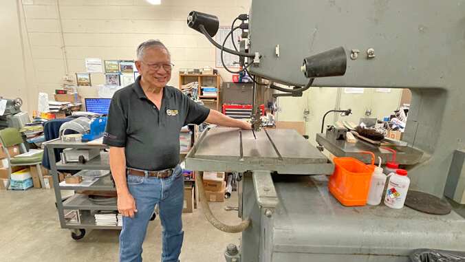 person standing next to a machine
