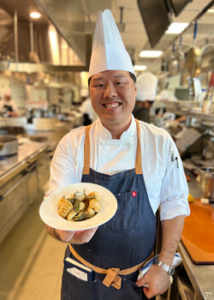 Chef holding a plate of food