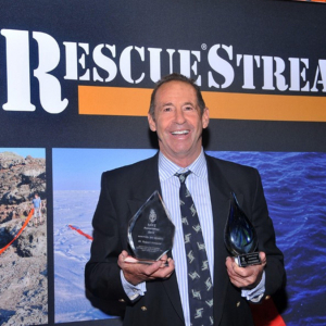 Yonover holding two awards