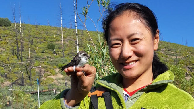 Wu with bird on her hand