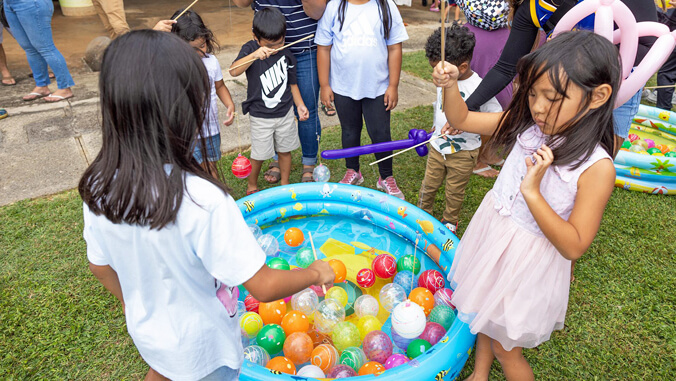 kids playing a fishing game
