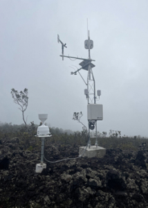 large machine on land in the clouds