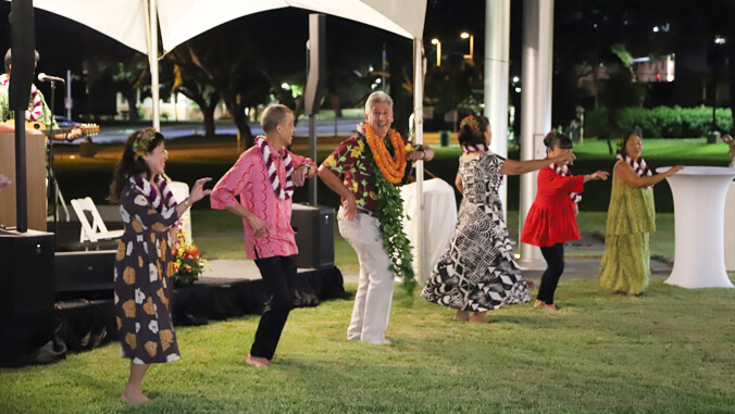 President Lassner dancing hula