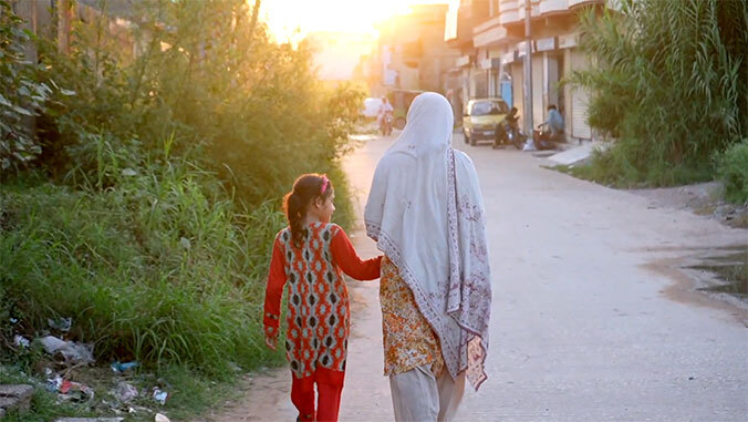 Woman walking with her daughter