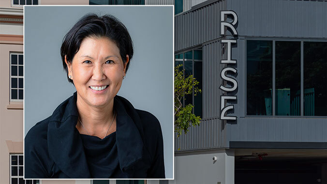 Susan Yamada with the rise building