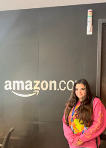 person in front of an Amazon sign