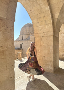person dancing next to a large structure