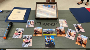 Table with photos of butchery class students