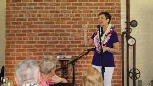 Hensel at a microphone