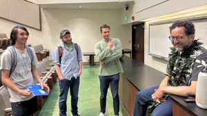 four people talking to each other