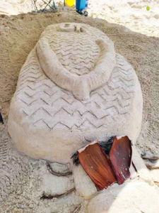 rubber slipper sand sculpture