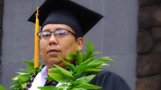 Rivera in graduation cap