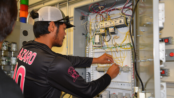 Lazaro working on electrical wiring