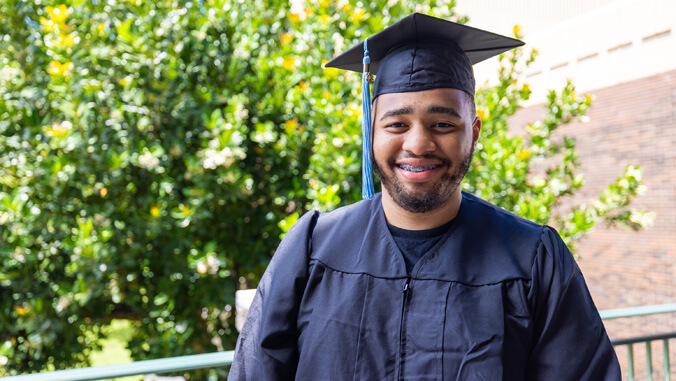 Keshawn Wright wearing this graduation cap and gown